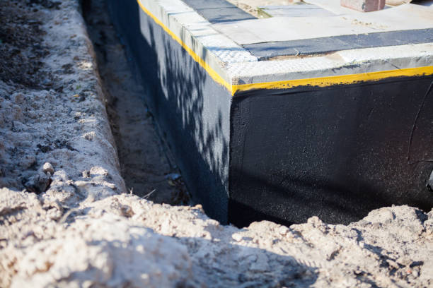 Professional Waterproofing technician working in Caledonia, OH